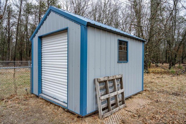 W4742 26th St, Necedah, WI 54646 - view of outdoor structure featuring fence and an outbuilding