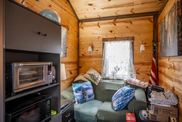 W4742 26th St, Necedah, WI 54646 - living area featuring lofted ceiling, a toaster, and wooden walls
