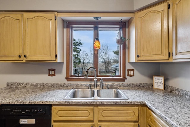 kitchen with light countertops, light brown cabinetry, a sink, and black dishwasher