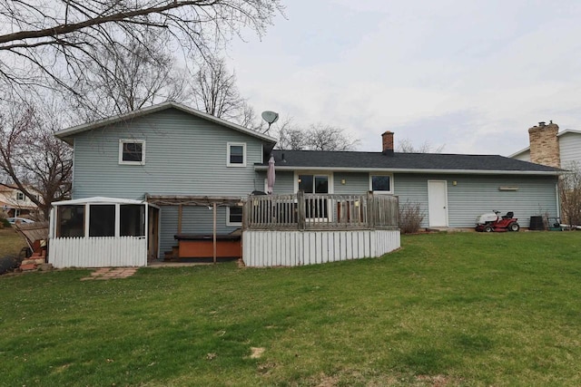 2282 Collier Ct, Green Bay, WI 54311 - back of property featuring a hot tub, a sunroom, a wooden deck, and a lawn