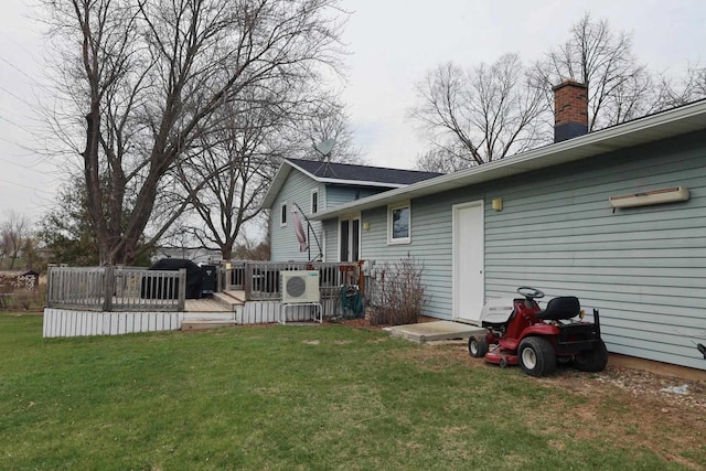 2282 Collier Ct, Green Bay, WI 54311 - view of grassy yard featuring a wooden deck and a cooling unit