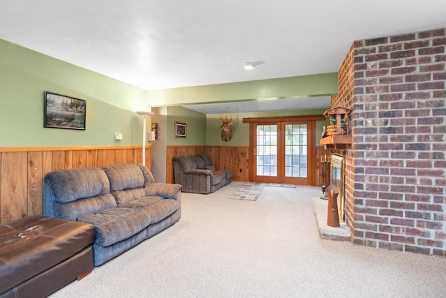 2282 Collier Ct, Green Bay, WI 54311 - living area with a wainscoted wall, carpet flooring, wooden walls, and a brick fireplace