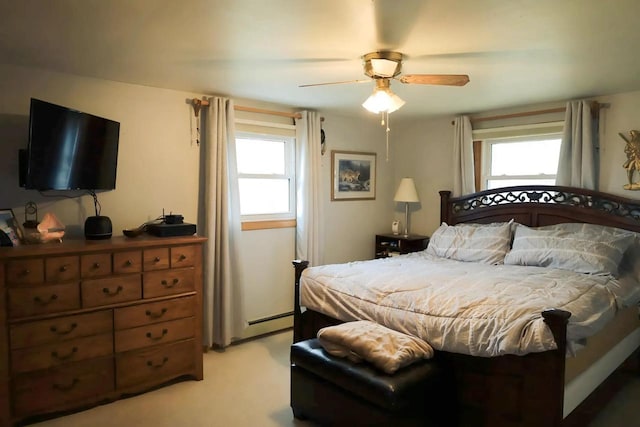 2282 Collier Ct, Green Bay, WI 54311 - bedroom with light colored carpet, ceiling fan, and a baseboard heating unit