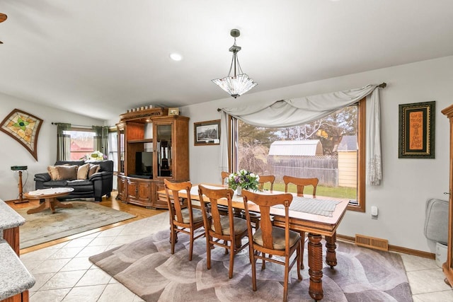 dining area with visible vents and light tile patterned floors