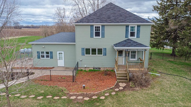 414 State Road 26, Oshkosh, WI 54904 - view of front of property with fence, a porch, a shingled roof, and a front yard