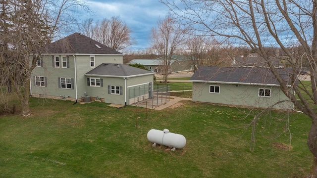414 State Road 26, Oshkosh, WI 54904 - rear view of house with a yard and roof with shingles