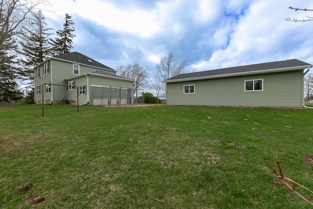 414 State Road 26, Oshkosh, WI 54904 - view of yard with central air condition unit and a sunroom