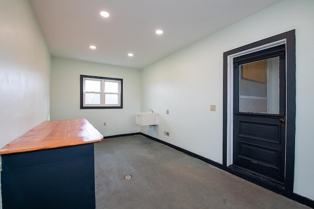 414 State Road 26, Oshkosh, WI 54904 - laundry area featuring carpet, baseboards, and recessed lighting