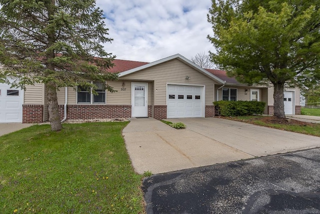 single story home with an attached garage, concrete driveway, a front yard, and brick siding