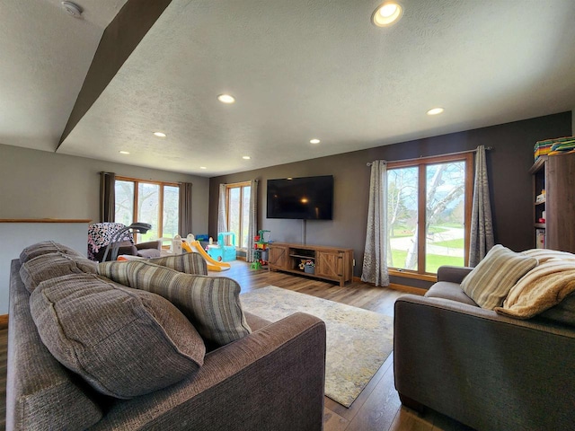 12902 Flicker Rd, Tomah, WI 54660 - living room featuring recessed lighting, wood finished floors, and a textured ceiling