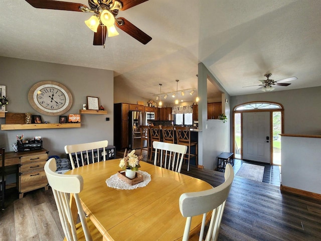 12902 Flicker Rd, Tomah, WI 54660 - dining space featuring ceiling fan, lofted ceiling, wood finished floors, and baseboards