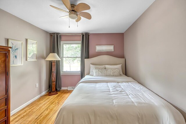 1301 Temkin Ave, Madison, WI 53705 - bedroom with light wood-type flooring, baseboards, and a ceiling fan