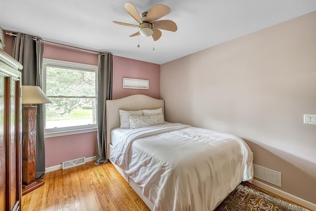 1301 Temkin Ave, Madison, WI 53705 - bedroom featuring baseboards, light wood-type flooring, and ceiling fan