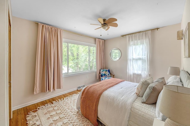 1301 Temkin Ave, Madison, WI 53705 - bedroom with light wood finished floors, baseboards, and a ceiling fan