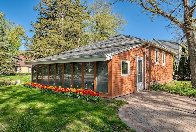 1301 Temkin Ave, Madison, WI 53705 - view of outdoor structure featuring a sunroom