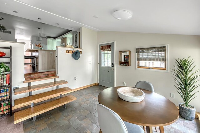 1301 Temkin Ave, Madison, WI 53705 - dining room featuring lofted ceiling and baseboards