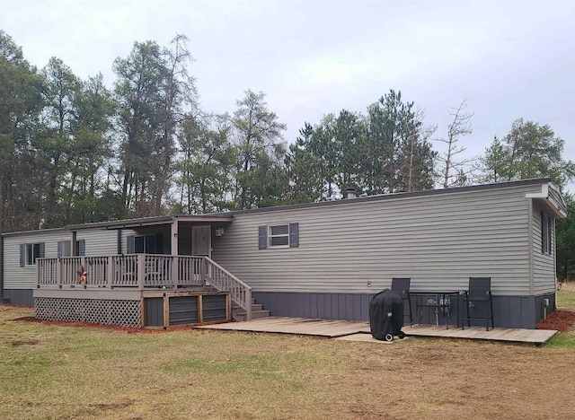 N9140 Snow Snake Trl, Necedah, WI 54646 - back of property with a wooden deck and a lawn