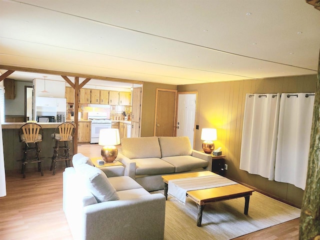 N9140 Snow Snake Trl, Necedah, WI 54646 - living area with light wood finished floors and wood walls