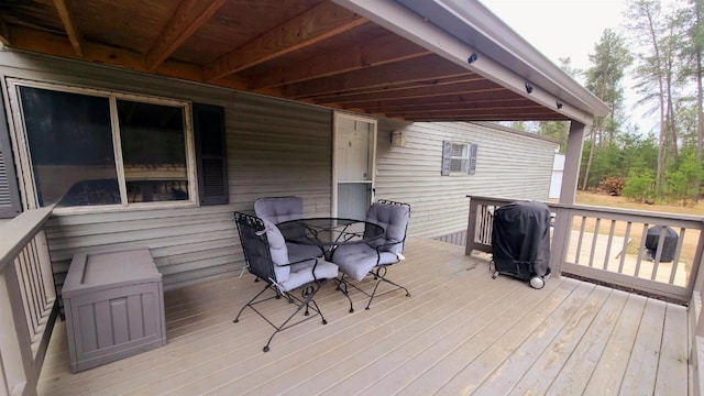 N9140 Snow Snake Trl, Necedah, WI 54646 - deck with outdoor dining area and a grill