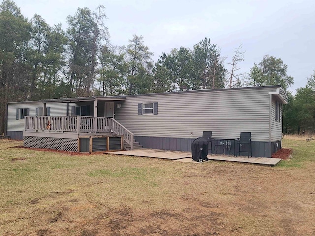 N9140 Snow Snake Trl, Necedah, WI 54646 - rear view of house with a yard and a deck
