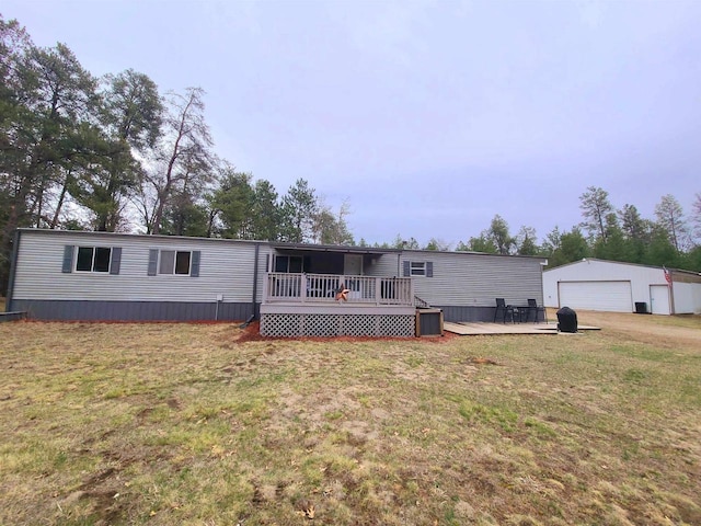 N9140 Snow Snake Trl, Necedah, WI 54646 - back of house with a yard, a detached garage, an outbuilding, and a deck