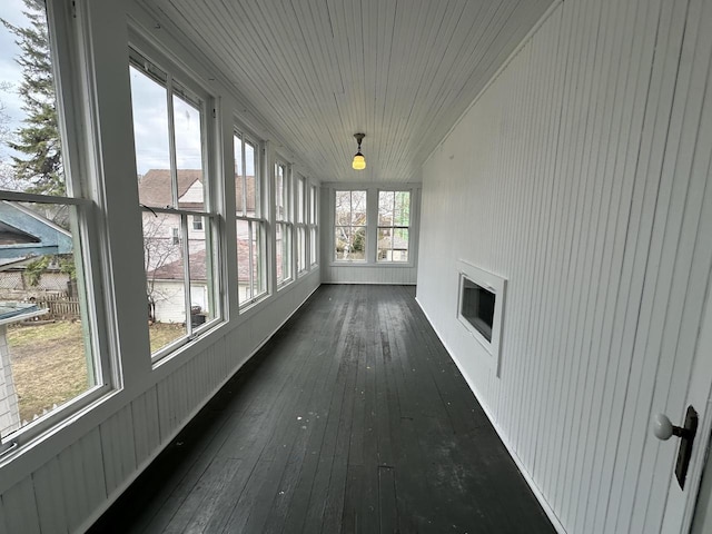 3313 W Kilbourn Ave, Milwaukee, WI 53208 - unfurnished sunroom with wood-type flooring and wood ceiling