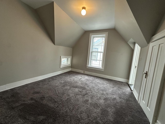 3313 W Kilbourn Ave, Milwaukee, WI 53208 - additional living space with carpet floors, lofted ceiling, and baseboards