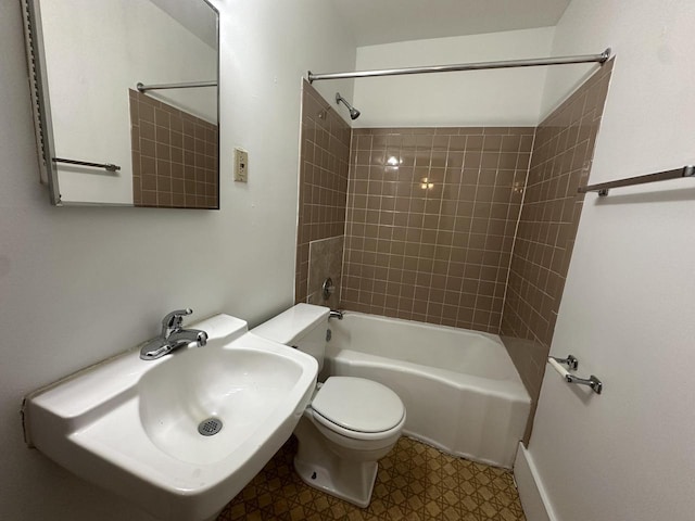 3313 W Kilbourn Ave, Milwaukee, WI 53208 - bathroom with bathtub / shower combination, tile patterned floors, a sink, and toilet