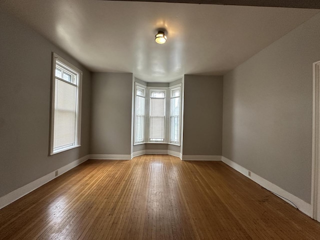 3313 W Kilbourn Ave, Milwaukee, WI 53208 - unfurnished room featuring wood finished floors and baseboards