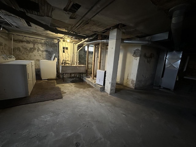 3313 W Kilbourn Ave, Milwaukee, WI 53208 - unfinished basement with washing machine and dryer, heating unit, and a sink