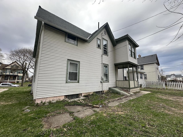 3313 W Kilbourn Ave, Milwaukee, WI 53208 - back of house with fence and a yard