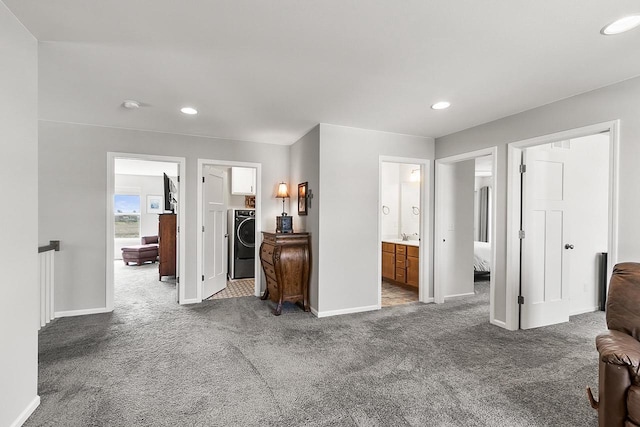 bedroom featuring recessed lighting, baseboards, washer / dryer, and carpet