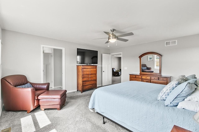carpeted bedroom with ceiling fan, baseboards, and visible vents