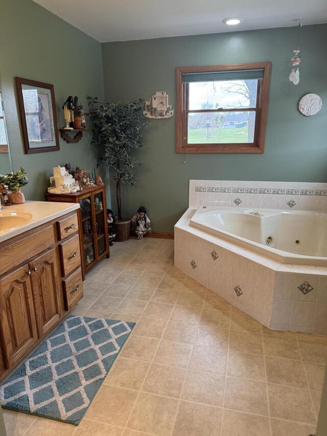 W360S10139 Markham Rd, Eagle, WI 53119 - bathroom featuring a whirlpool tub, tile patterned flooring, and vanity