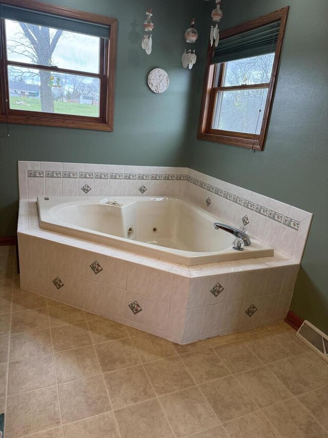 W360S10139 Markham Rd, Eagle, WI 53119 - bathroom featuring a whirlpool tub, visible vents, and tile patterned floors