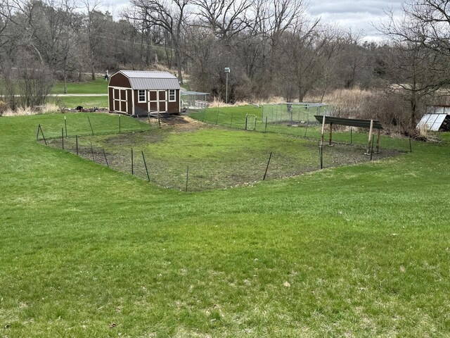 W360S10139 Markham Rd, Eagle, WI 53119 - view of yard featuring fence, an outbuilding, and a storage shed
