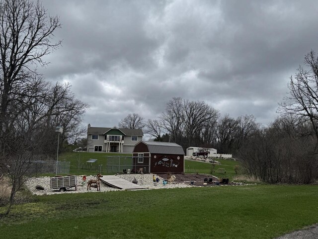 W360S10139 Markham Rd, Eagle, WI 53119 - surrounding community featuring a lawn, an outdoor structure, fence, and a shed