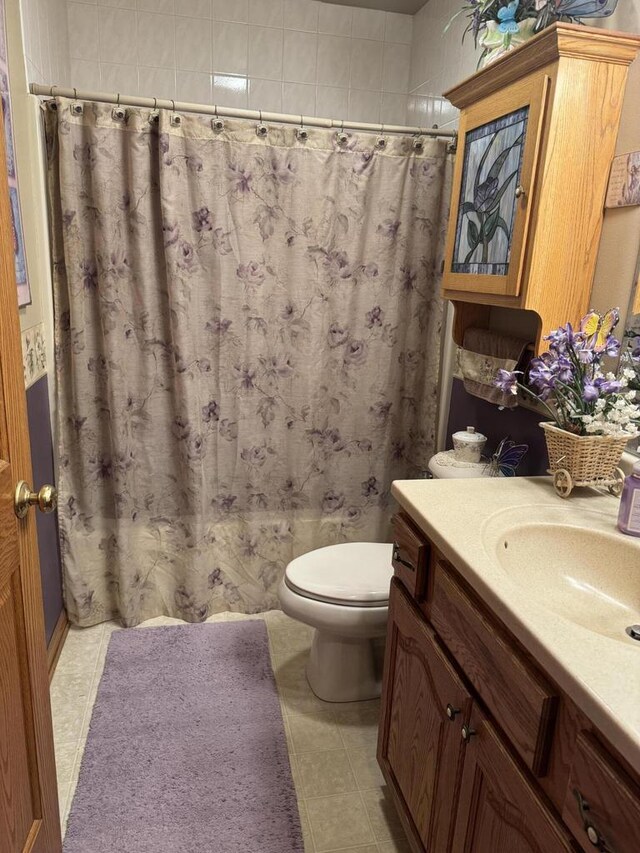 W360S10139 Markham Rd, Eagle, WI 53119 - full bathroom featuring a shower with curtain, tile patterned floors, vanity, and toilet