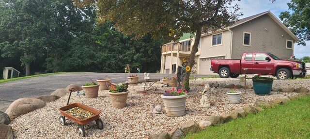 W360S10139 Markham Rd, Eagle, WI 53119 - exterior space with a garage and a balcony