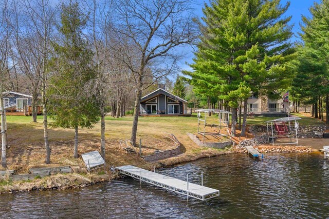 905 Plymouth Ct, Nekoosa, WI 54457 - view of dock featuring a water view and a yard