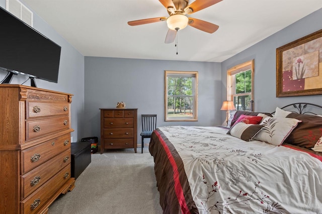 905 Plymouth Ct, Nekoosa, WI 54457 - bedroom with visible vents, light colored carpet, and ceiling fan
