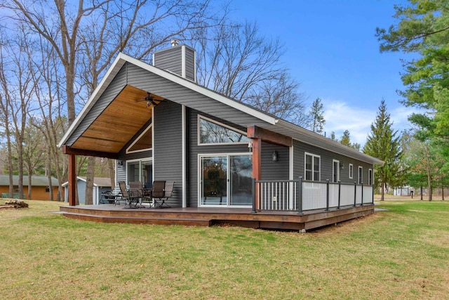 905 Plymouth Ct, Nekoosa, WI 54457 - back of property with a chimney, a yard, cooling unit, ceiling fan, and a deck