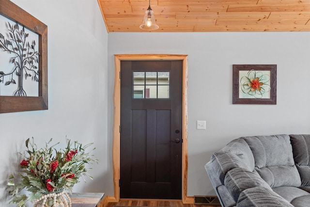 905 Plymouth Ct, Nekoosa, WI 54457 - entryway featuring baseboards, vaulted ceiling, wood ceiling, and wood finished floors