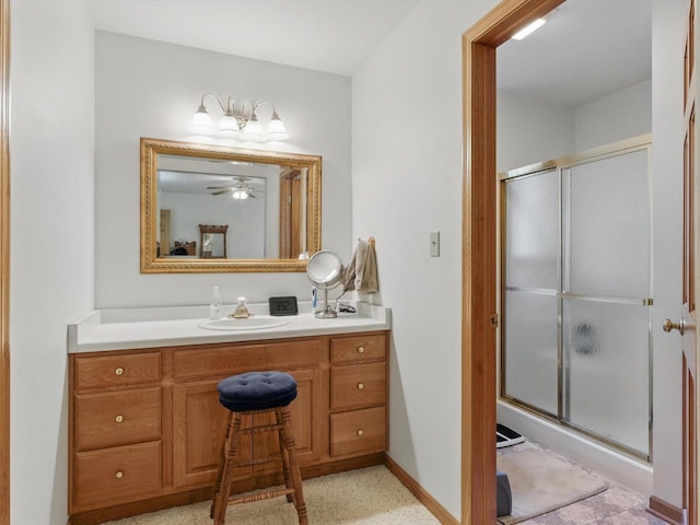 W7436 County Road V, Cascade, WI 53011 - bathroom featuring baseboards, a shower stall, a ceiling fan, and vanity