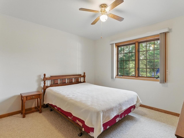 W7436 County Road V, Cascade, WI 53011 - bedroom featuring a ceiling fan, baseboards, and light colored carpet