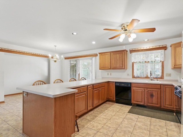 W7436 County Road V, Cascade, WI 53011 - kitchen with a sink, a breakfast bar area, light tile patterned floors, light countertops, and black dishwasher