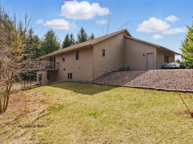 W7436 County Road V, Cascade, WI 53011 - back of property with cooling unit and a lawn