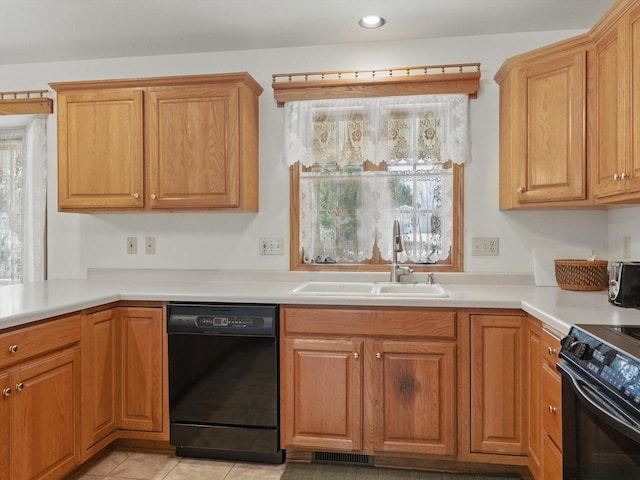 W7436 County Road V, Cascade, WI 53011 - kitchen with light countertops, electric stove, visible vents, a sink, and black dishwasher