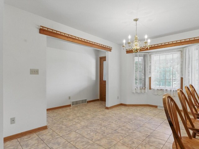 W7436 County Road V, Cascade, WI 53011 - unfurnished dining area featuring baseboards, visible vents, an inviting chandelier, and light tile patterned floors