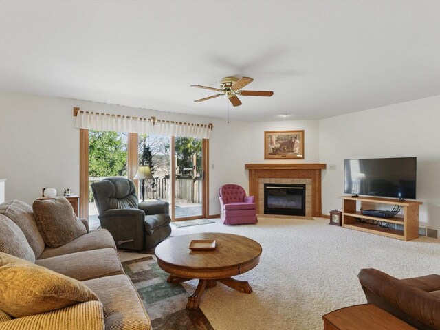 W7436 County Road V, Cascade, WI 53011 - living room featuring carpet floors, a ceiling fan, and a fireplace